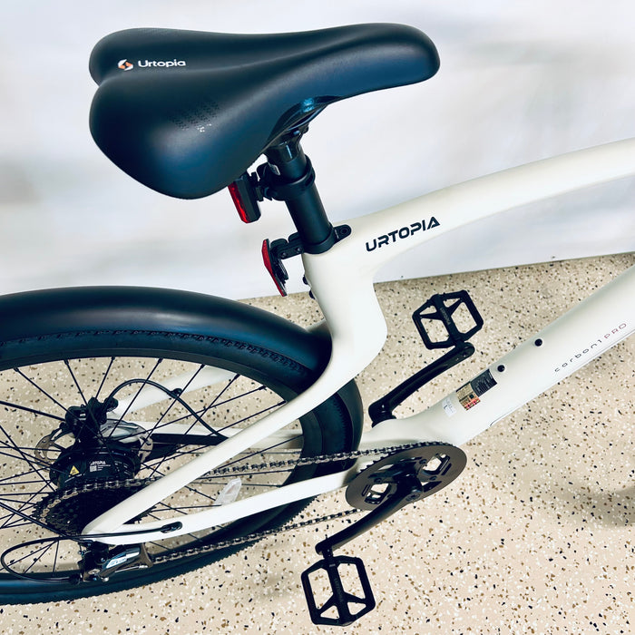 Urtopia Carbon 1 Pro eBike with black seat on a light background.