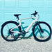 Urtopia Carbon 1 Pro eBike parked against a light blue garage door background.