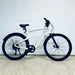 Urtopia Carbon 1 Pro eBike parked on a light gray floor against a white wall.