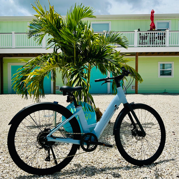 Urtopia Carbon Step-Thru ebike parked in front of Fort Myers Beach rental house First Mango.