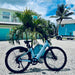 Urtopia Carbon ST Glacier Blue ebike parked outside Fort Myers Beach rental house First Mango.