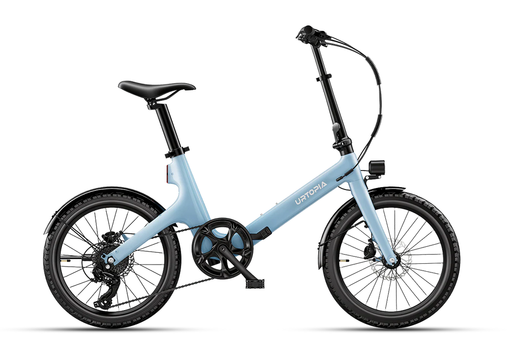 The Urtopia Carbon Fold ST in glacier blue folding electric bike with a step-through frame, black saddle, and black tires, shown from a side profile on a white background.