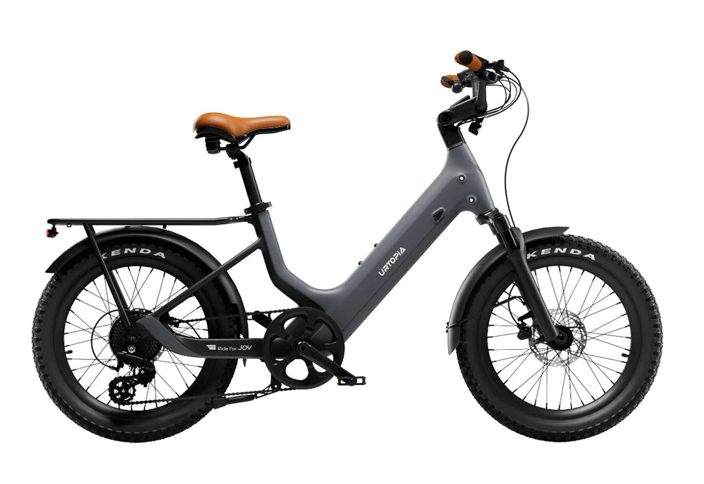 Urtopia Joy Carbon electric bike in charcoal grey with a brown seat on a white background