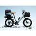 Urtopia Joy Carbon e-bike in glacier blue with cargo bags on a clear blue sky background