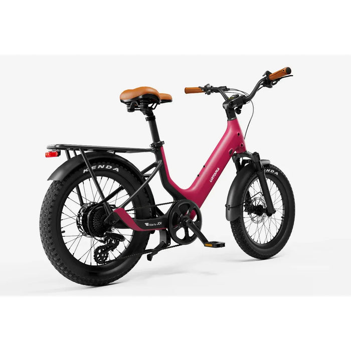 Rose Red Urtopia Joy Carbon electric bike at an angle with Kenda tires on a white background