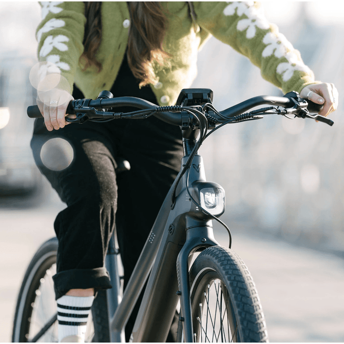 Girl riding Vvolt Alpha II Gates E-Bike.