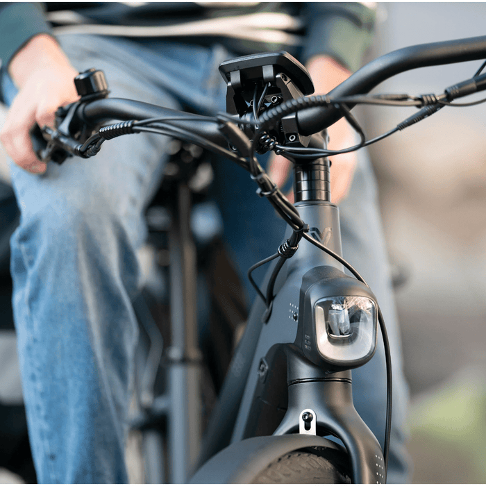 Guy sitting on Vvolt Alpha II E- Bike.